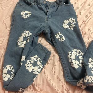 Stylish Denim Tears Blue Jeans with White Floral Accents